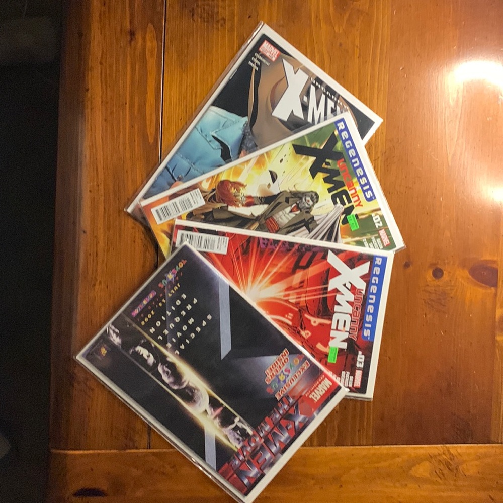 Set of 4 different x-men comics.